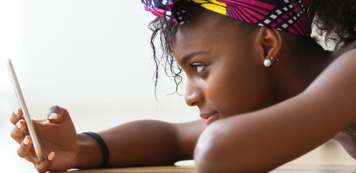 Get the best bulk SMS solutions with mNotify: Woman using our service to communicate